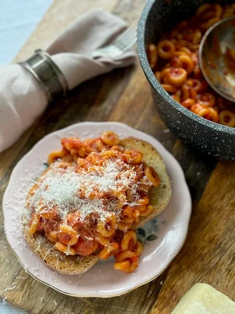 pasta hoops on toast with cheese with saucepan and label