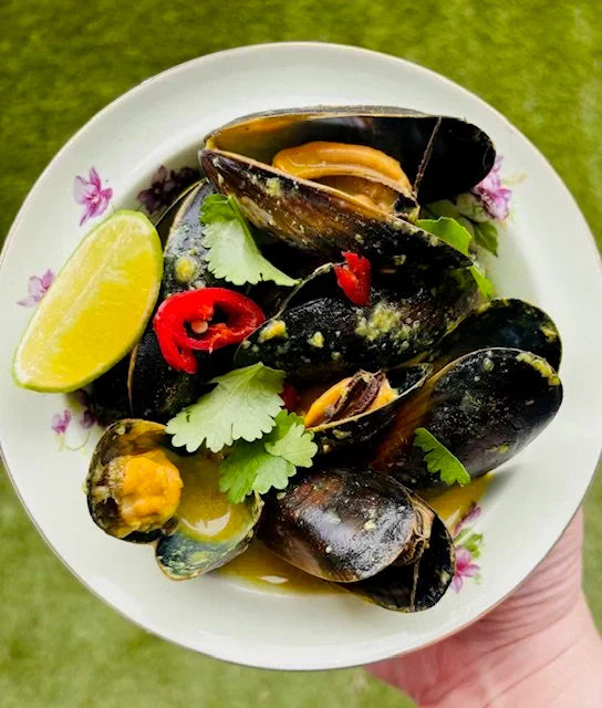 mussels in flower bowl with chillies and coriander