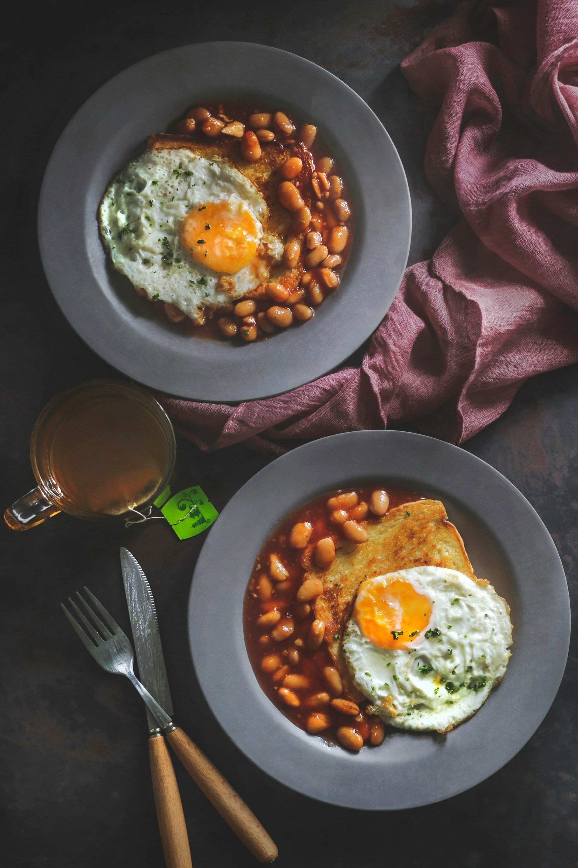 beans on toast with egg on gothic sytle background