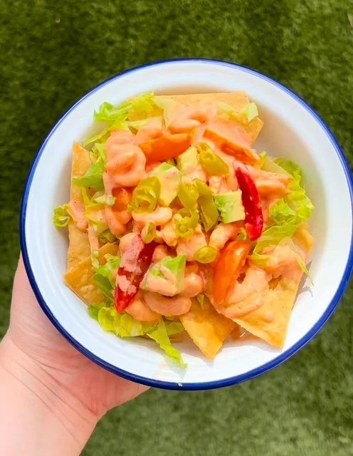 blue and white bowl with tortilla chips with pickled chillies