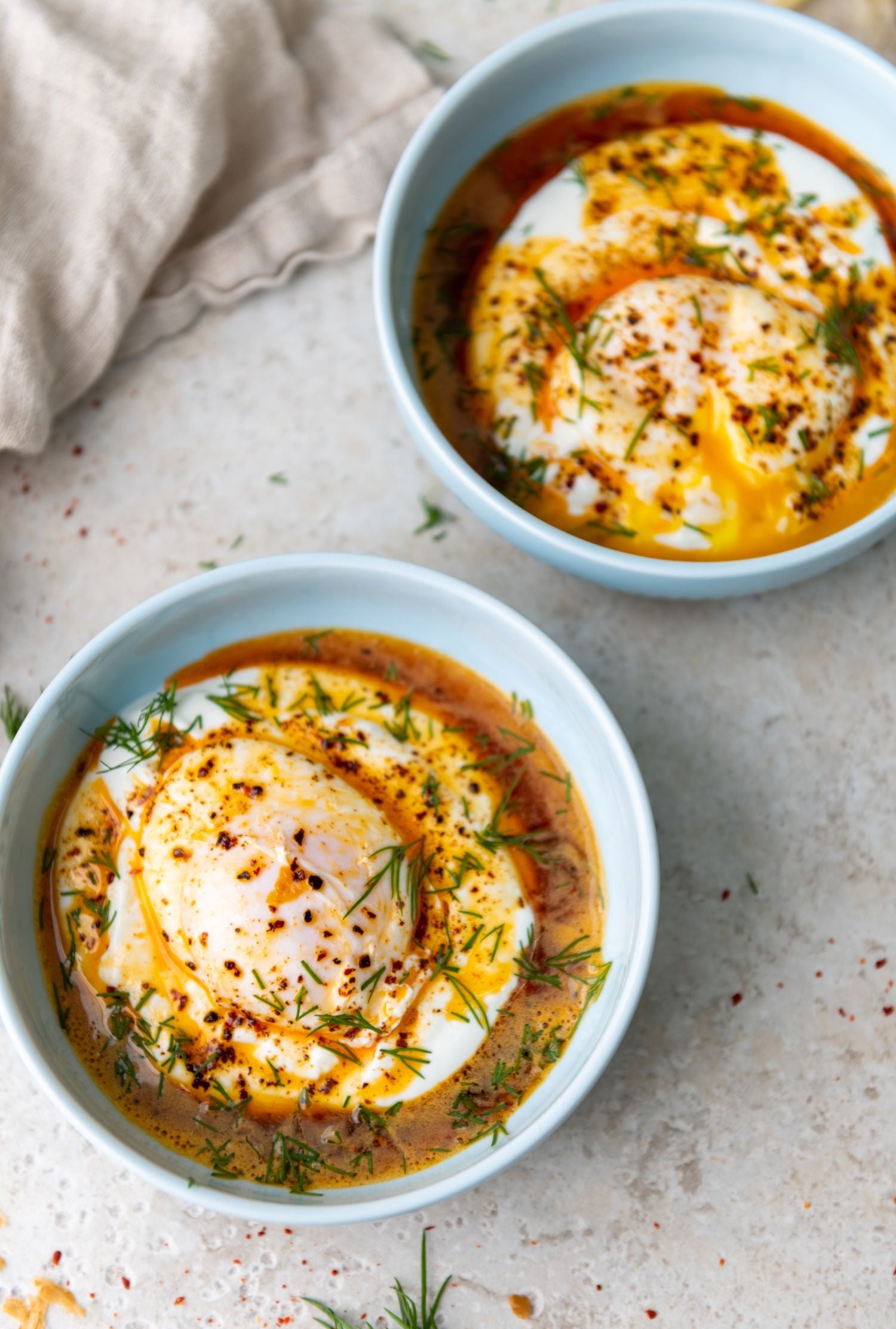 Translation missing: en.Poached eggs with chilli oil, fresh dill and creamy yoghurt, served with crusty bread: European Pantry