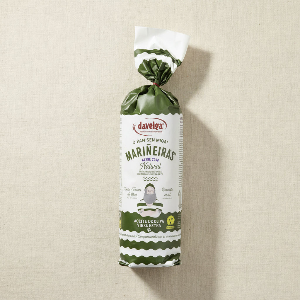 A package of Daveiga Marineiras Natural Olive Oil, wrapped in a white and green patterned paper bag, shown against a plain white background.