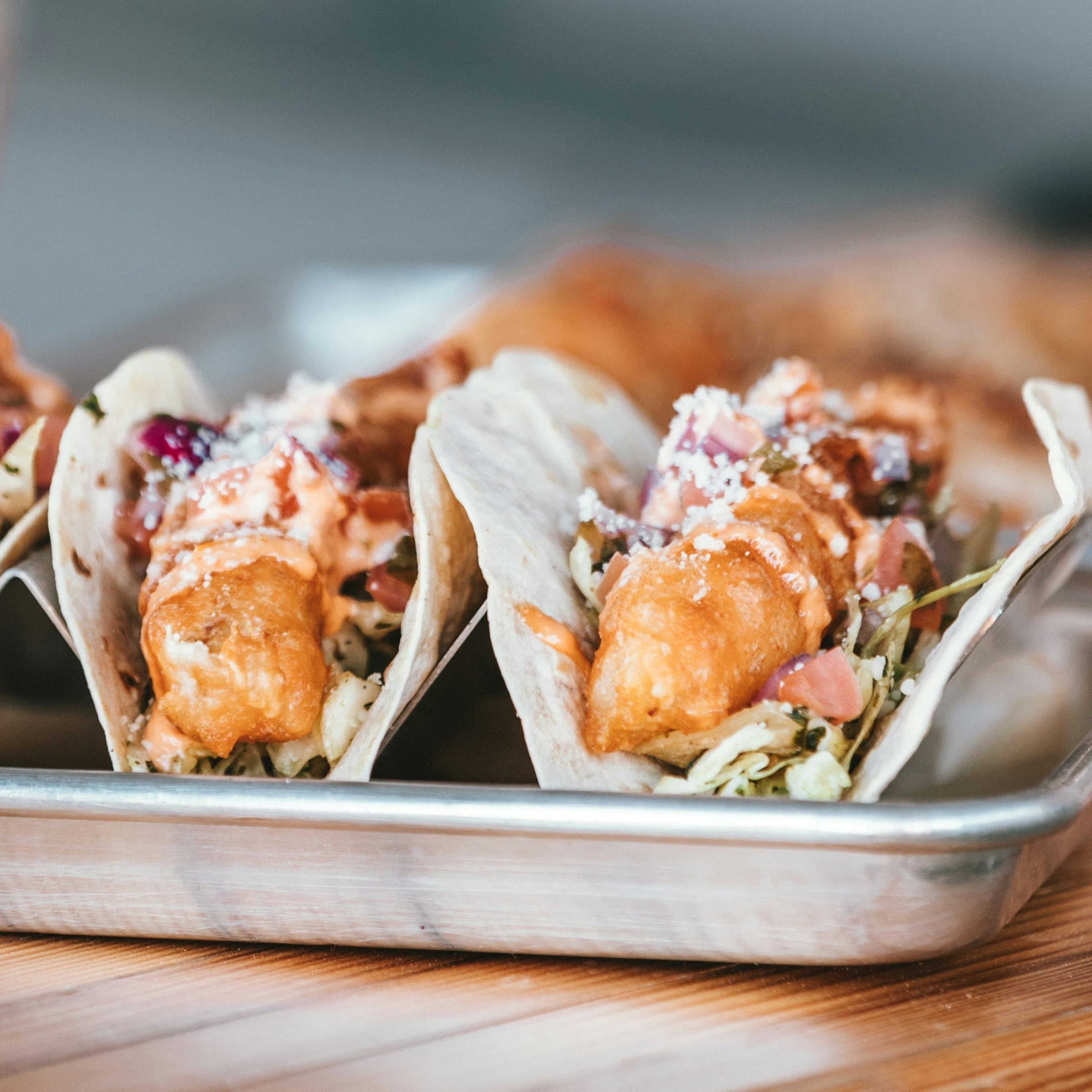 Tray of fish  tacos with a blurred background